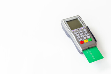 Close up of bank payment terminal with credit cards, top view. Banking and shopping concept