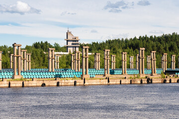 Fototapeta premium Karelia, Russia, July 9, 2024. A warehouse of barrels in the ruins of an industrial plant.