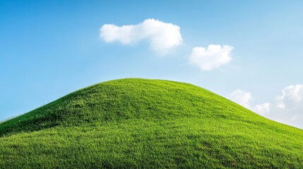 Fototapeta premium A serene landscape image showcasing a rolling green hilltop against a backdrop of a clear blue sky dotted with fluffy white clouds. The scene symbolizes tranquility, renewal, growth, and the beauty of