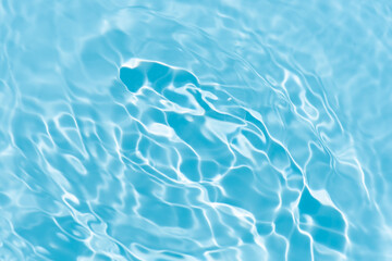 Blue water with ripples on the surface. Defocus blurred transparent blue colored clear calm water...