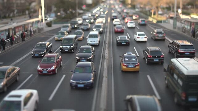 Down Shot Traffic Flowing With Tilt Shift Lens At Sunset Video