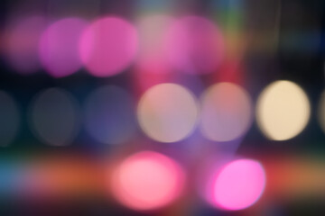 A blurry image of a group of colorful circles. The circles are of different sizes and colors, and they appear to be overlapping each other. The image has a dreamy, ethereal quality to it