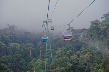 Cable car in the fog.Beautiful nature trail (da nang,vietnam)hill station and resort located in the...