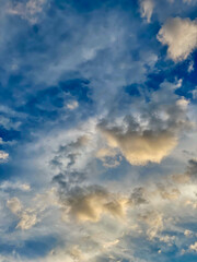 Clouds in the blue sky at sunset as an abstract background