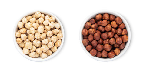 Bowls plates with organic brown and white hazelnut nuts isolated on white background.Top view.