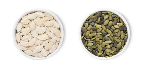 Bowls with organic white and green pumpkin seeds isolated on white background.Top view.