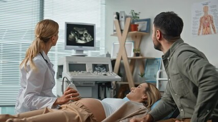 Expecting parents visiting ultrasound examination at clinic feeling excited. - Powered by Adobe