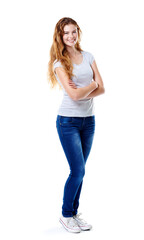 Obraz premium Portrait, fashion and woman with arms crossed, smile and model isolated on white studio background. Face, person and girl with confidence, pride or gen z with stylish clothes, casual outfit or trendy