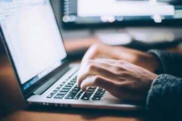 Hands Typing on a Laptop Computer