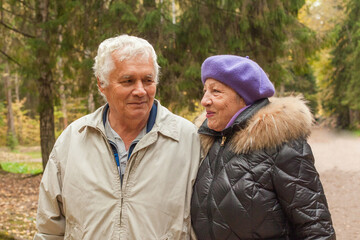 Fototapeta premium Senior couple in love on walk in autumn park