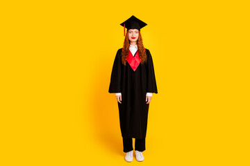 Photo of charming girl graduate wear black robe finish college education isolated on yellow color background