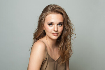 Happy healthy young woman, beautiful face closeup on white background