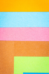 Fototapeta premium Multicolor background from a paper of different colors. Abstract colorful vibrant paper textures.