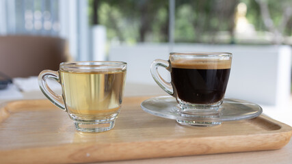 Cup of hot espresso coffee on a table.