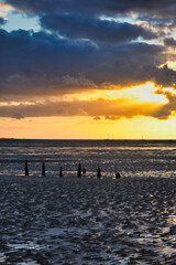 A breathtaking moment as the sun sets over the vast expanse of the ocean.