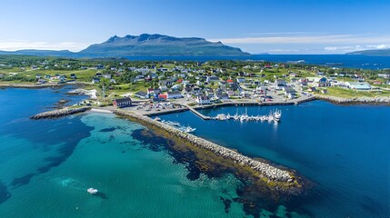 Fototapeta premium Aerial view of a picturesque coastal village on a sunny day.