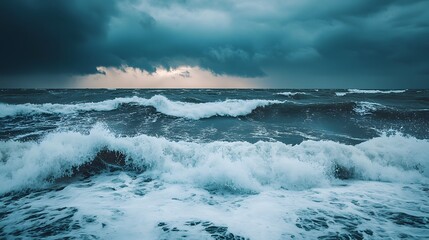 Fototapeta premium Dramatic seascape with turbulent waves under a moody sky.