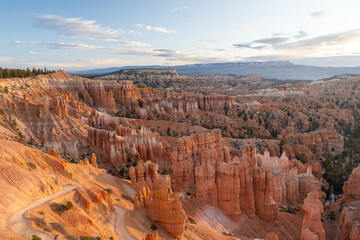 Stunning sunrise views of red rocks and hoodoos at Bryce Canyon National Park.