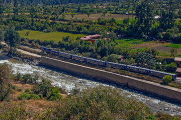 Train heading through the Andes in Peru with stunning landscape, Ollantaytambo is the last stop to get train to Machu Picchu at Peru