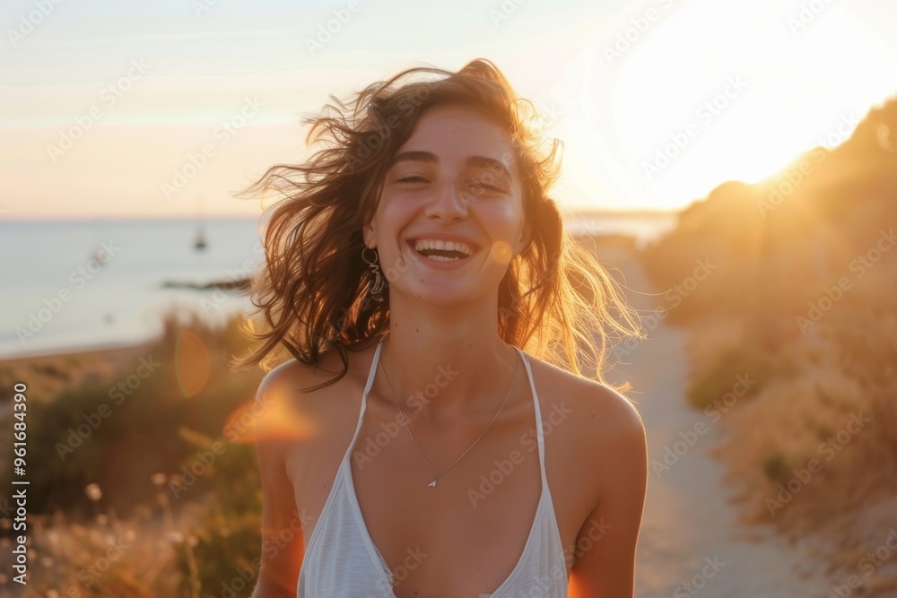 Wall mural delighted woman enjoying breezy beach run bright sunlight. glowing joy woman running along tranquil 