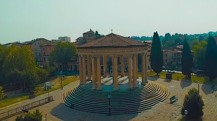 Fototapeta premium Aerial view of a classical rotunda surrounded by greenery and historic buildings.