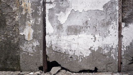 Cracked and Worn White Wall in a Run-Down Area