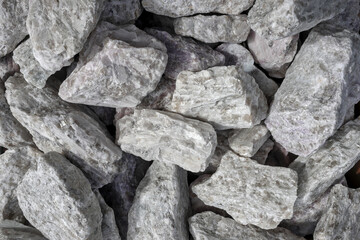 Hard rock spodumene ore, commercially important source of lithium. Mine, mining, background, copy space.