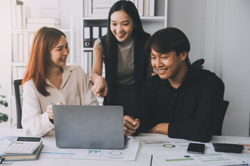 Financial analysts analyze business financial reports on a digital tablet planning investment project during a discussion at a meeting of corporate showing the results of their successful teamwork.