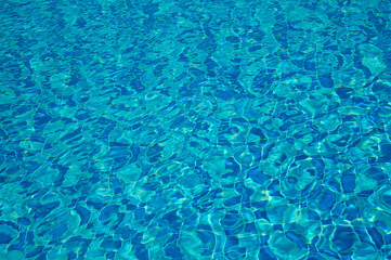 Swimming Pool Surface With Light Reflection and Water Ripple Patterns