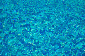 Swimming Pool Surface With Light Reflection and Water Ripple Patterns