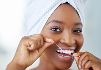 Dental hygiene, portrait and black woman with floss in bathroom for fresh breath in home. Happy,...