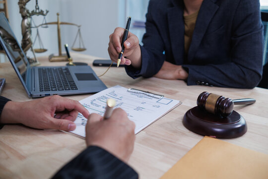 Lawyers sit inside the law office waiting to give advice to clients who need help with legal matters to prevent mistakes in business investment. Concept of receiving legal advice with team of lawyers.