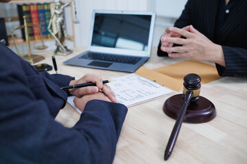 Lawyers sit inside the law office waiting to give advice to clients who need help with legal...