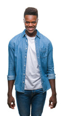 Young african american man over isolated background with a happy and cool smile on face. Lucky person.