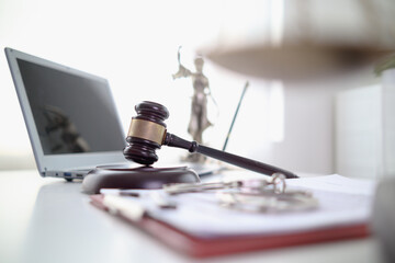 Judge gavel is placed on table in office of lawyer team It is gavel used as symbol of making decision in court case with fairness and ethics. judge gavel is prepared symbolize decision in court case.