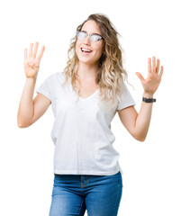 Beautiful young blonde woman wearing glasses over isolated background showing and pointing up with fingers number nine while smiling confident and happy.