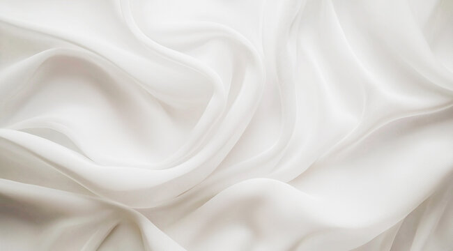 Luxurious folds of white silk fabric creating a soft and elegant texture.
