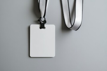 Blank id badge with lanyard on gray background for corporate events and conferences