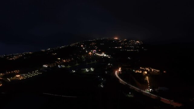 Day to Night Timelapse flowing clouds and village in the valley with light driving car at Phu Tub Berk, long exposure concept. 4k