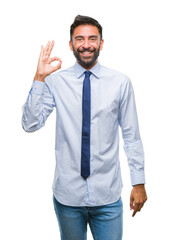 Adult hispanic business man over isolated background smiling positive doing ok sign with hand and fingers. Successful expression.