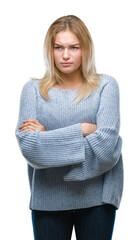 Young caucasian woman wearing winter sweater over isolated background skeptic and nervous,...