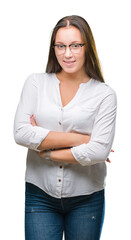 Young caucasian beautiful business woman wearing glasses over isolated background happy face smiling with crossed arms looking at the camera. Positive person.