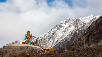 The Maitreya Buddha statue with Himalaya mountains, Diskit Monastery or Diskit Gompa, Diskit...
