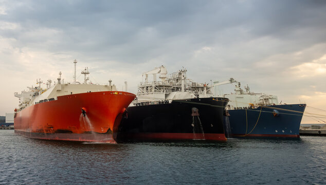 LNG gas oil tankers transferring gas. LNG tankers during ship-to-ship gas transfer operation
