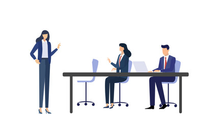 Three professionals engaged in discussion at a meeting table, surrounded by a contemporary office setting with greenery.