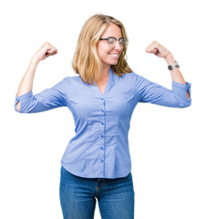 Beautiful young business woman over isolated background showing arms muscles smiling proud. Fitness concept.