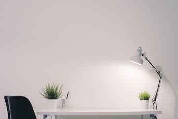 Simple workspace with plants and a lamp at a minimalist desk