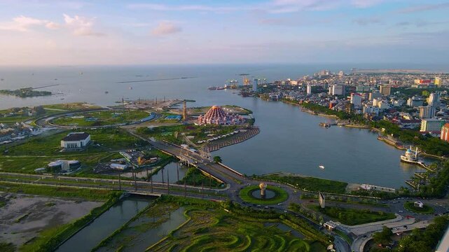 drone view of Makassar city with the icon of the 99 dome mosque, intersection monument, city and sea