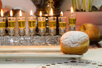 Olive oil Hanukkah candles burn brightly