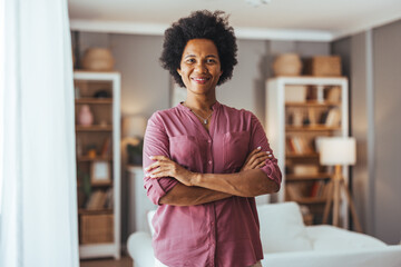 Confident Woman in Stylish Home Library Setting Smiling Brightly